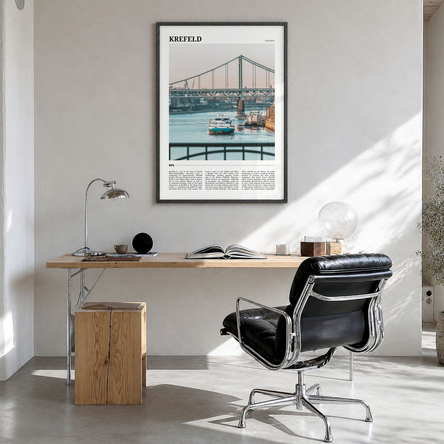 Krefeld Travel Poster in a black wood frame, hanging in a bright home office