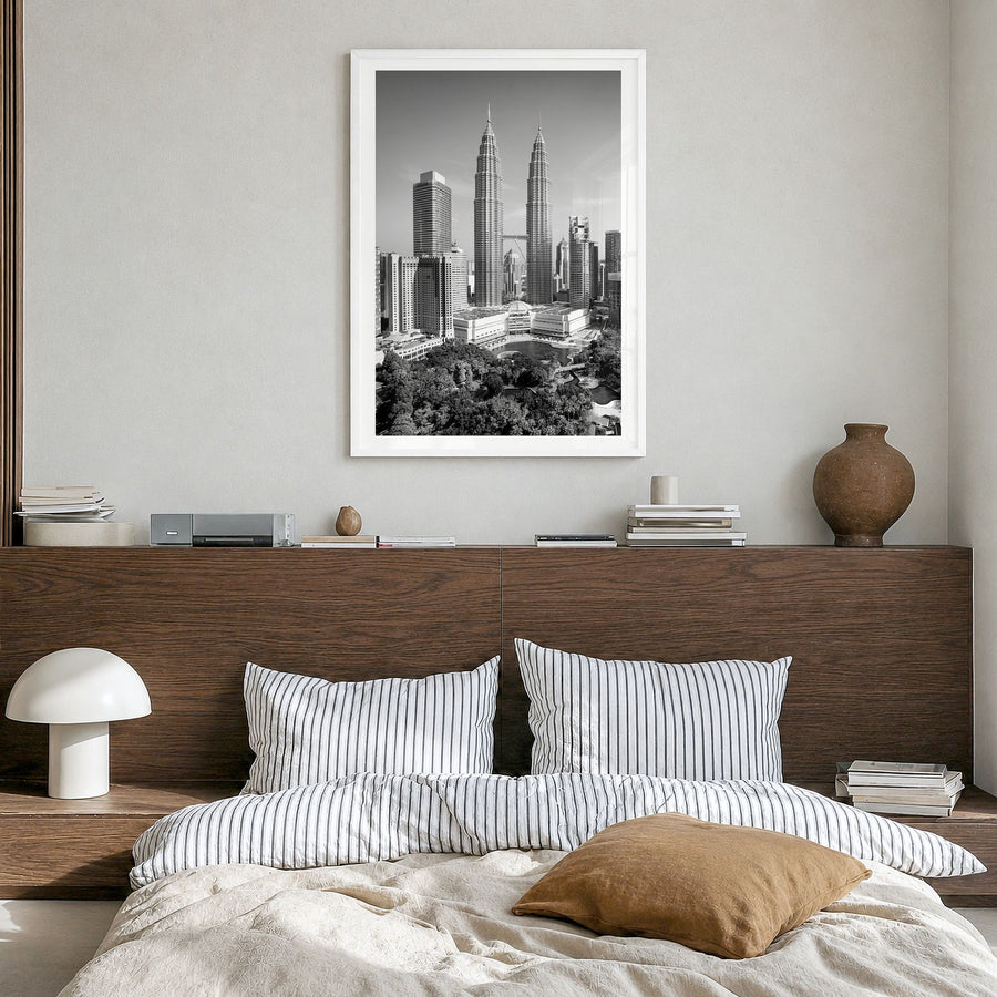 Kuala Lumpur Photo Poster in a white wood frame, hanging in a bedroom, white border
