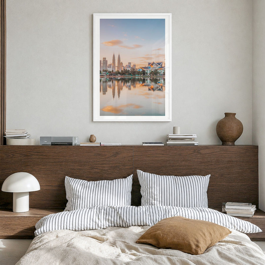Kuala Lumpur Photo Poster in a white wood frame, hanging in a bedroom, white border