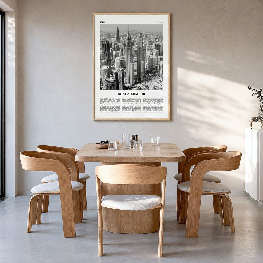 Kuala Lumpur Newspaper No 1 Poster in a natural wood frame, hanging in a dining room