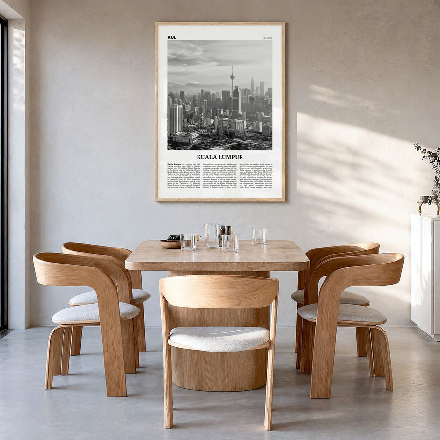 Kuala Lumpur Newspaper No 3 Poster in a natural wood frame, hanging in a dining room