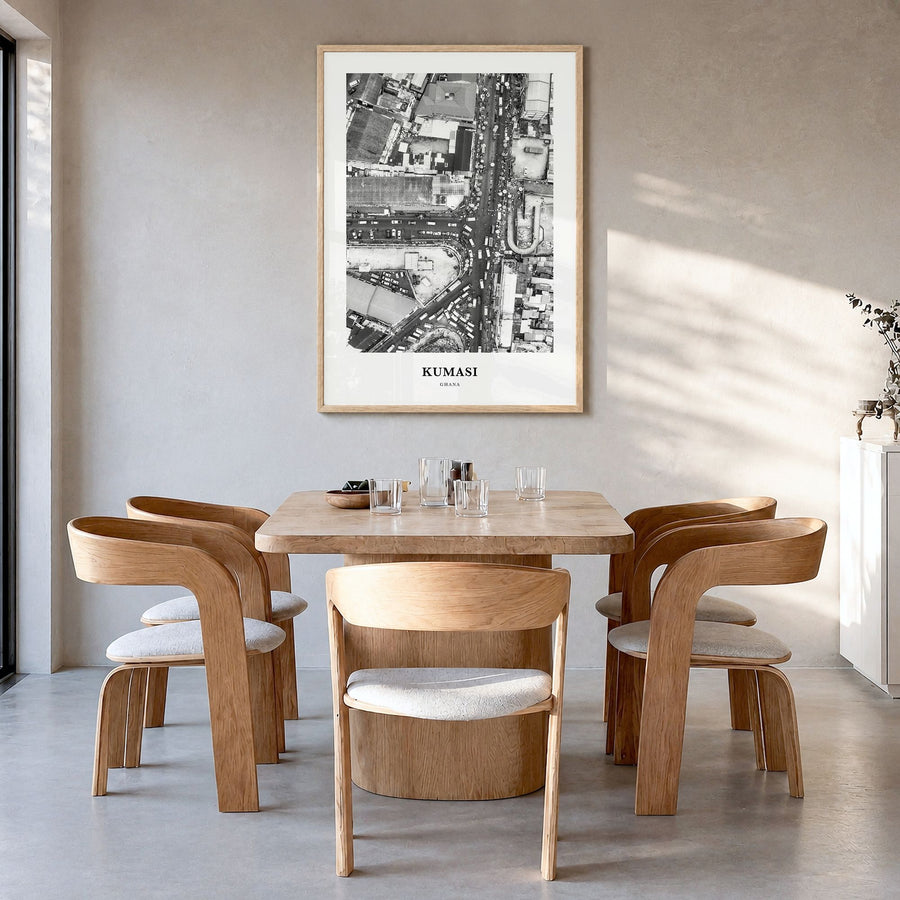 Kumasi Classic Poster in a natural wood frame, hanging in a dining room