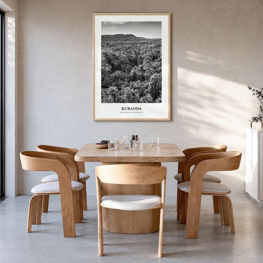 Kuranda Classic Poster in a natural wood frame, hanging in a dining room