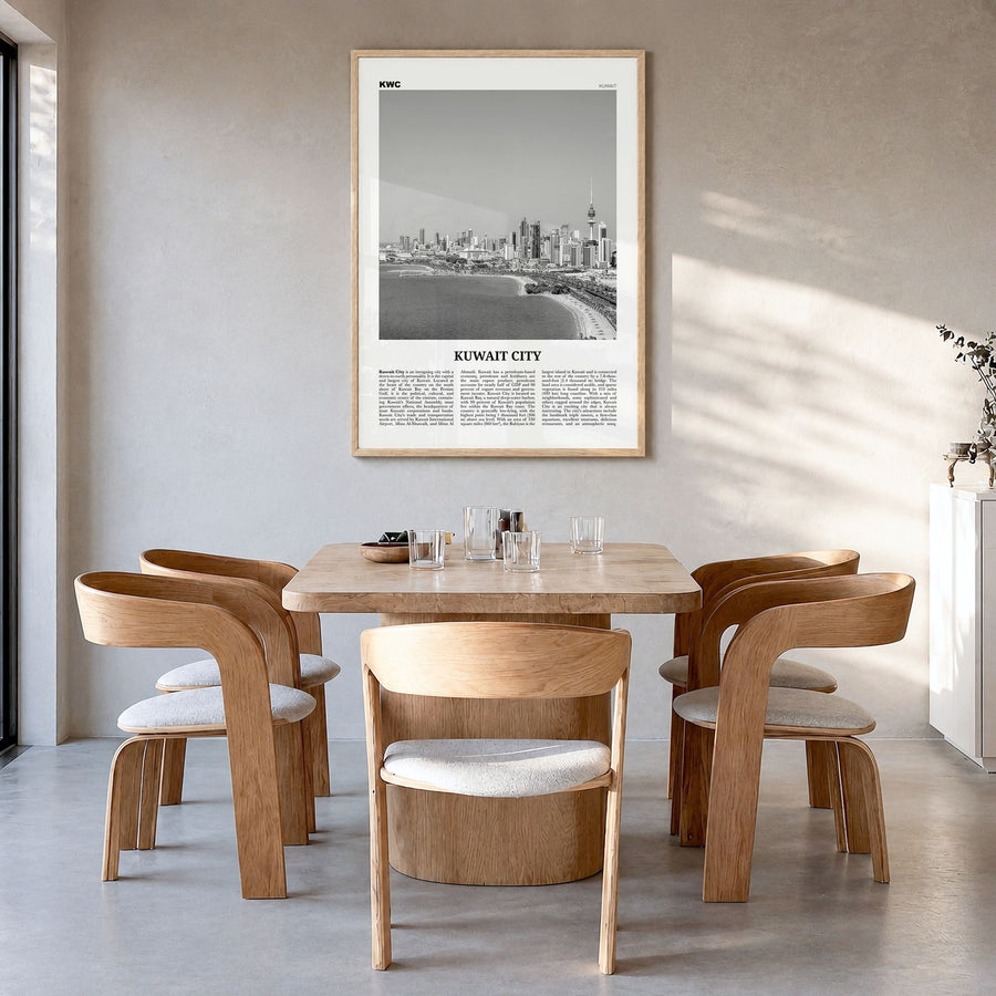 Kuwait City Newspaper Poster in a natural wood frame, hanging in a dining room
