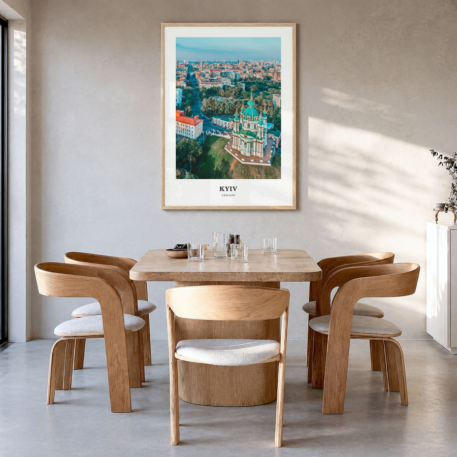 Kyiv Classic Poster in a natural wood frame, hanging in a dining room