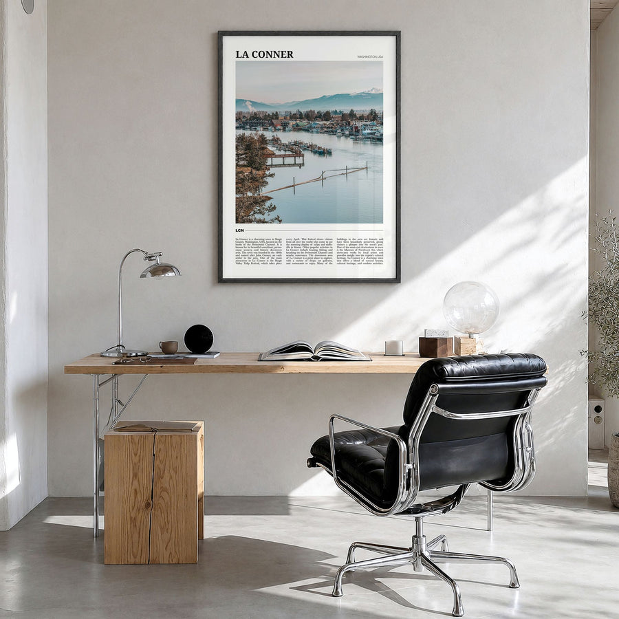 La Conner Travel Poster in a black wood frame, hanging in a bright home office