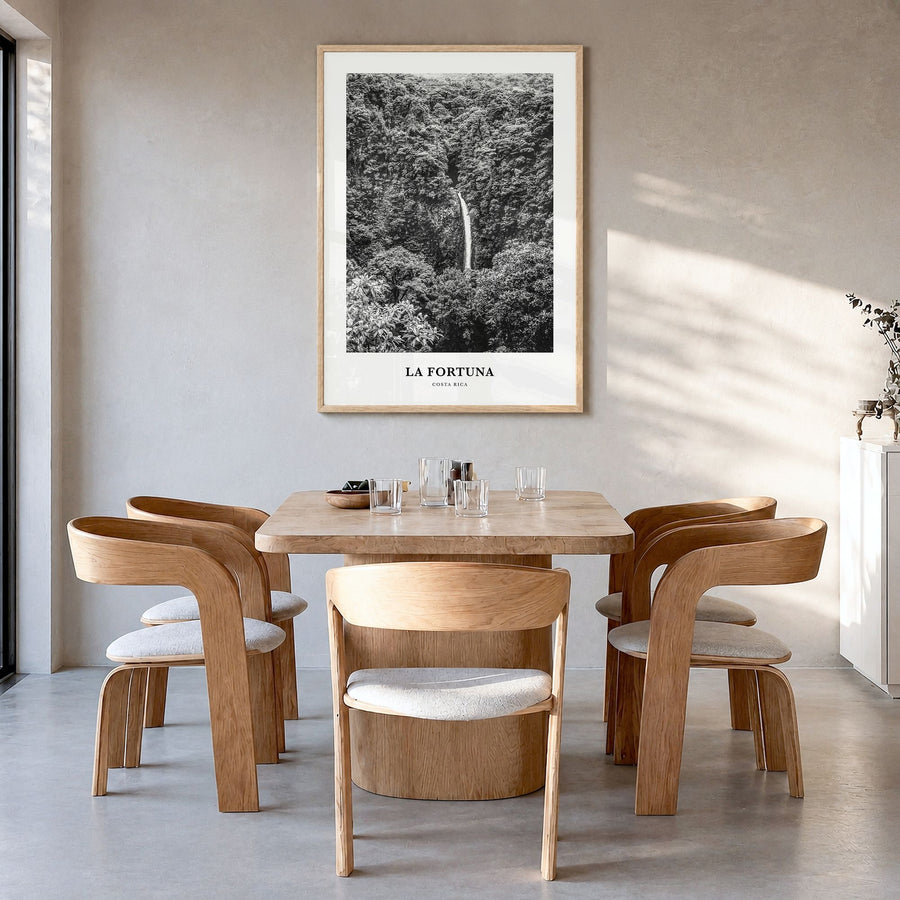 La Fortuna Classic Poster in a natural wood frame, hanging in a dining room