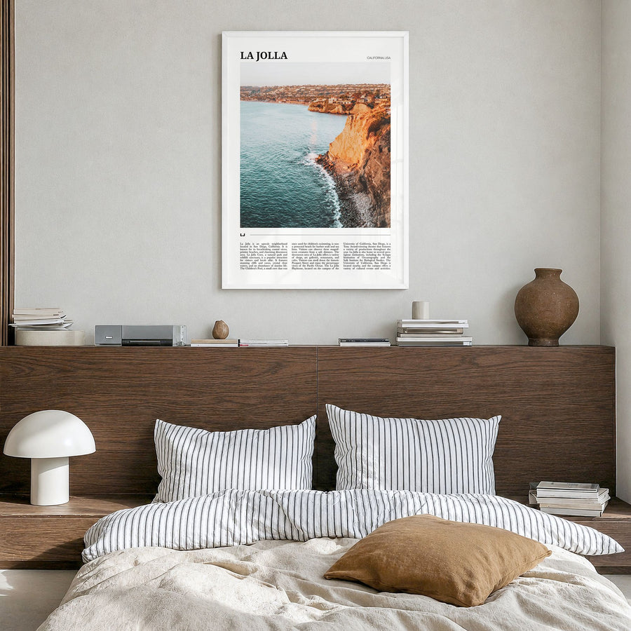 La Jolla Travel No 1 Poster in a white wood frame, hanging in a bedroom