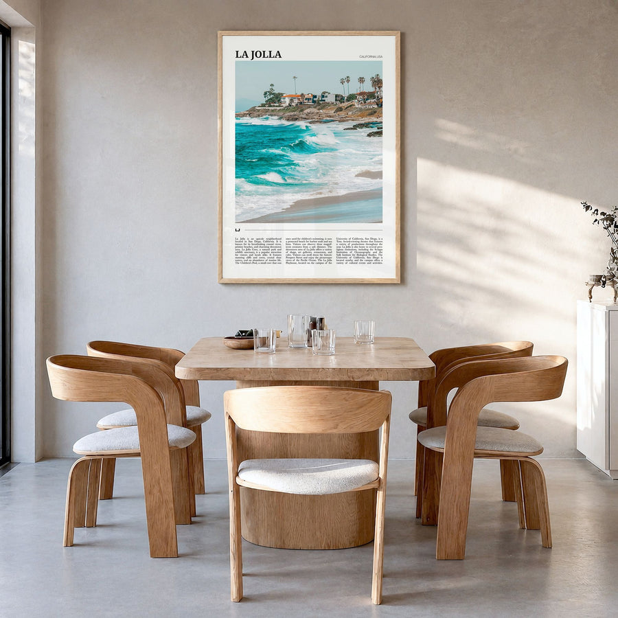 La Jolla Travel No 2 Poster in a natural wood frame, hanging in a dining room