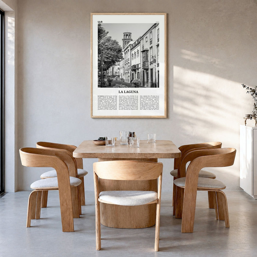 La Laguna Newspaper Poster in a natural wood frame, hanging in a dining room