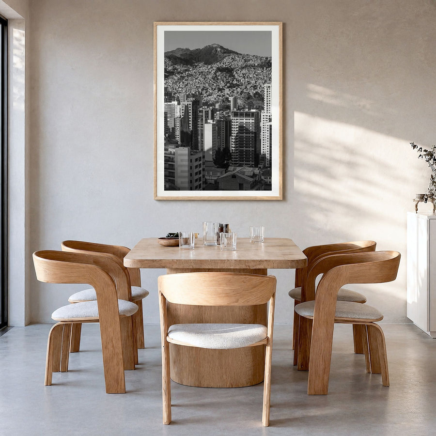 La Paz Photo Poster in a natural wood frame, hanging in a dining room, white border