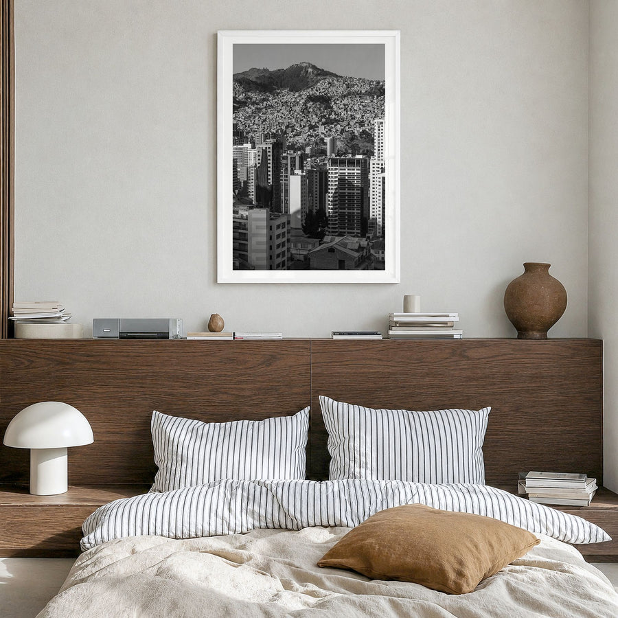 La Paz Photo Poster in a white wood frame, hanging in a bedroom, white border