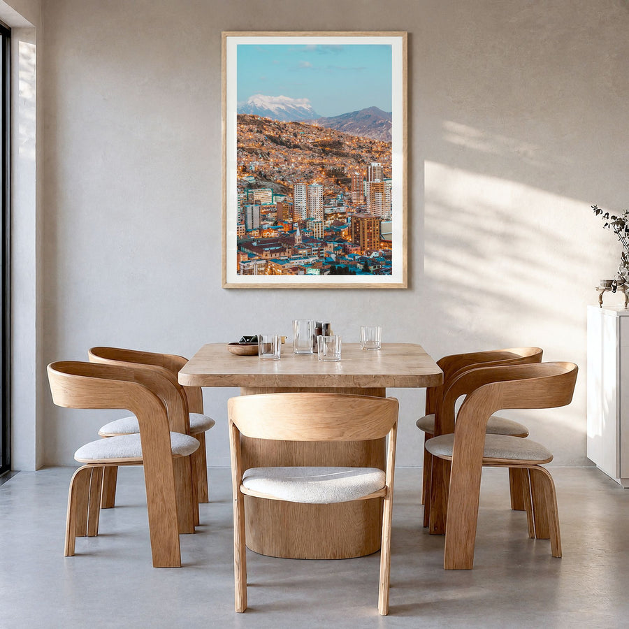 La Paz Photo Poster in a natural wood frame, hanging in a dining room, white border