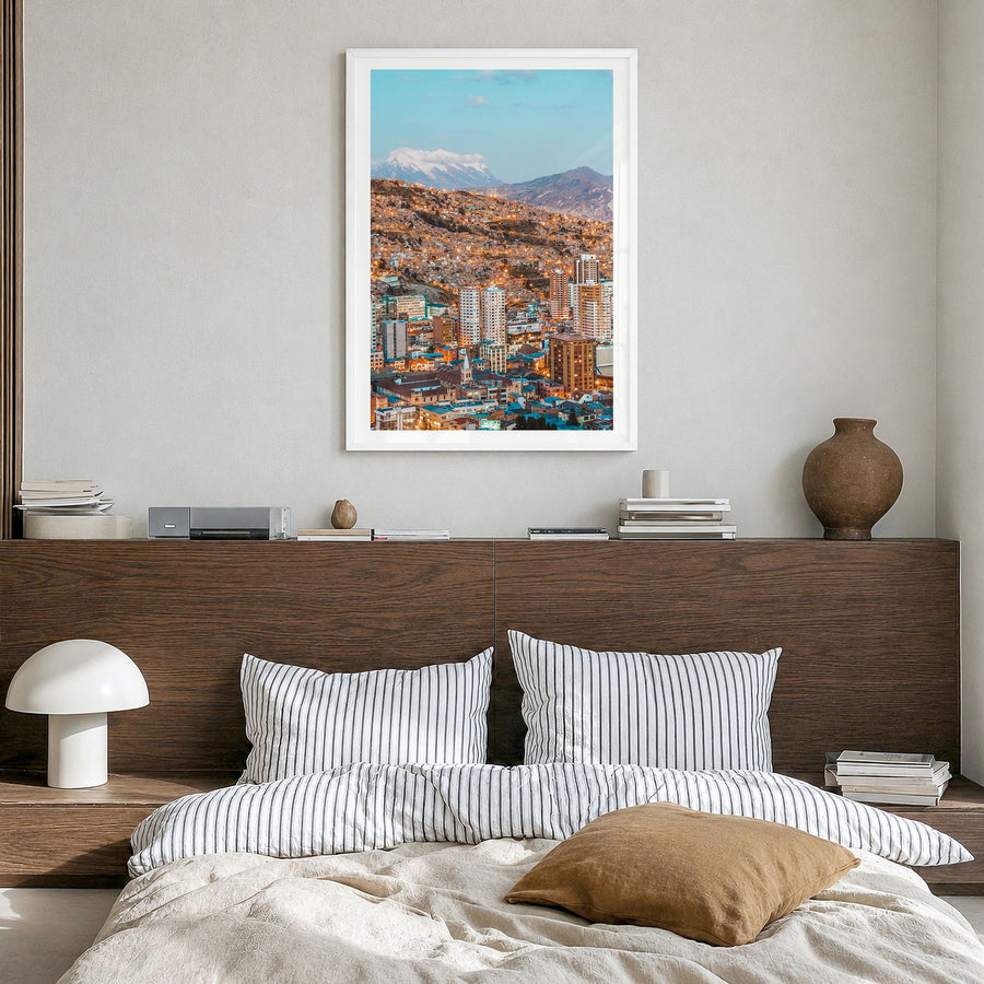 La Paz Photo Poster in a white wood frame, hanging in a bedroom, white border