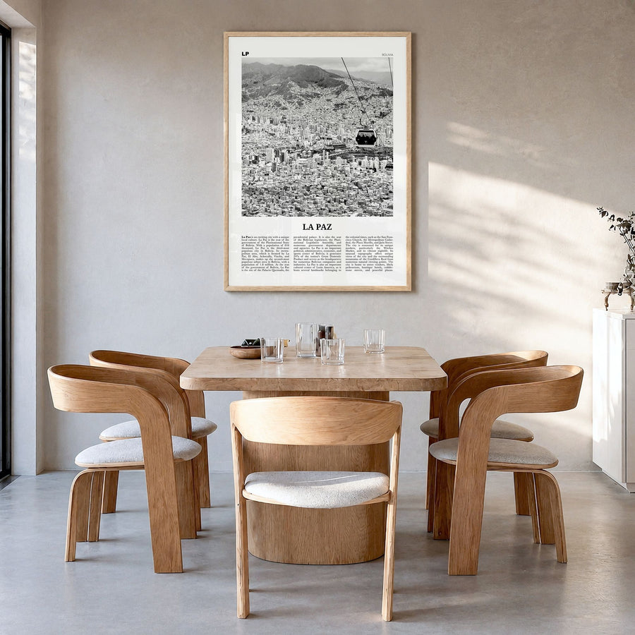 La Paz Newspaper Poster in a natural wood frame, hanging in a dining room