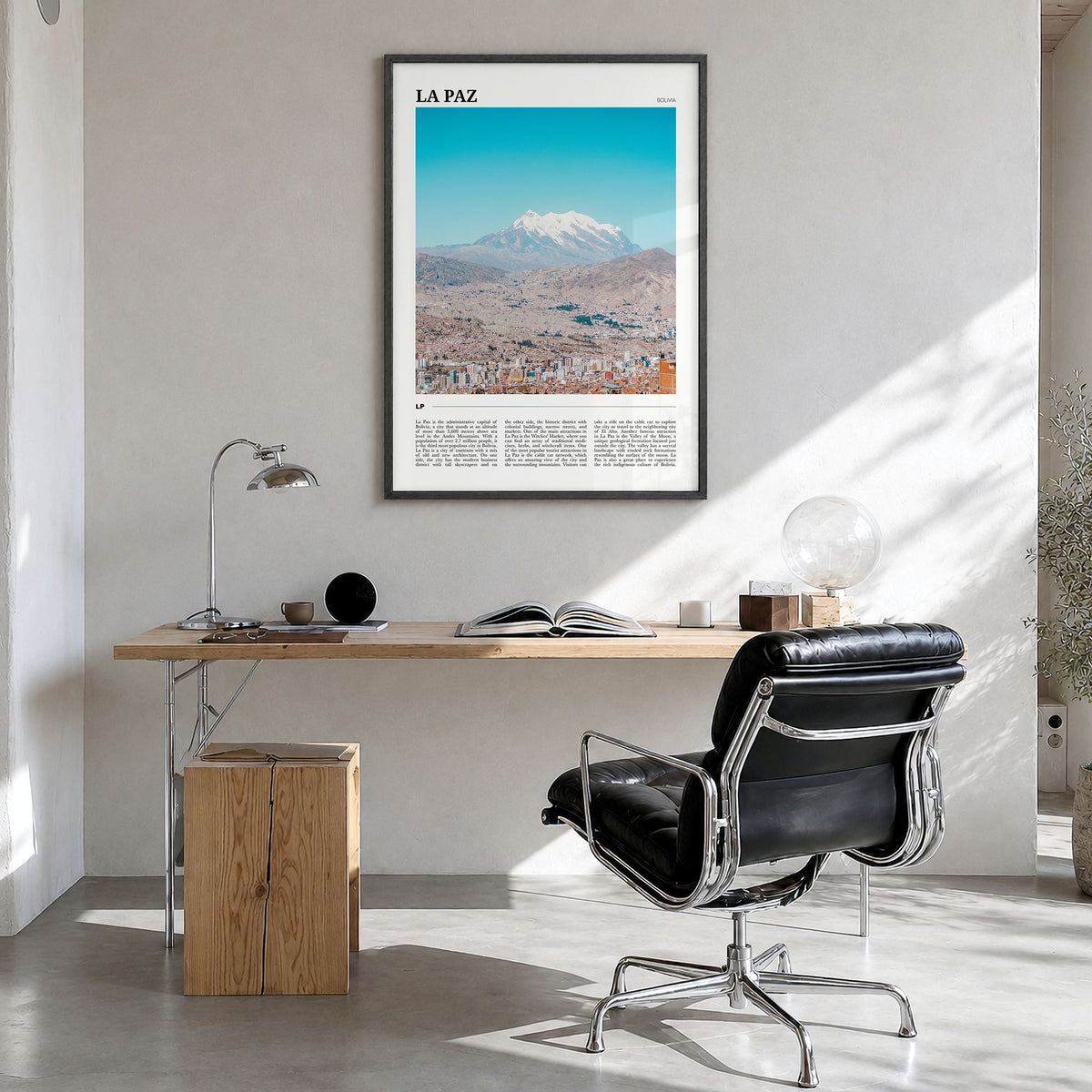 La Paz Travel Poster in a black wood frame, hanging in a bright home office