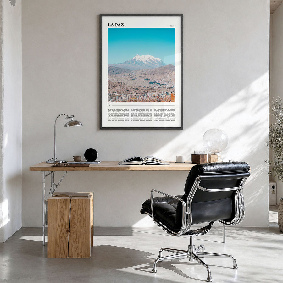 La Paz Travel Poster in a black wood frame, hanging in a bright home office
