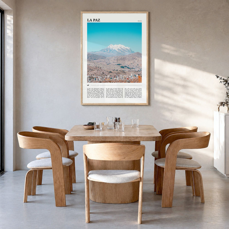 La Paz Travel Poster in a natural wood frame, hanging in a dining room
