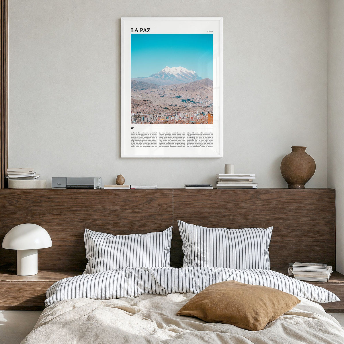 La Paz Travel Poster in a white wood frame, hanging in a bedroom