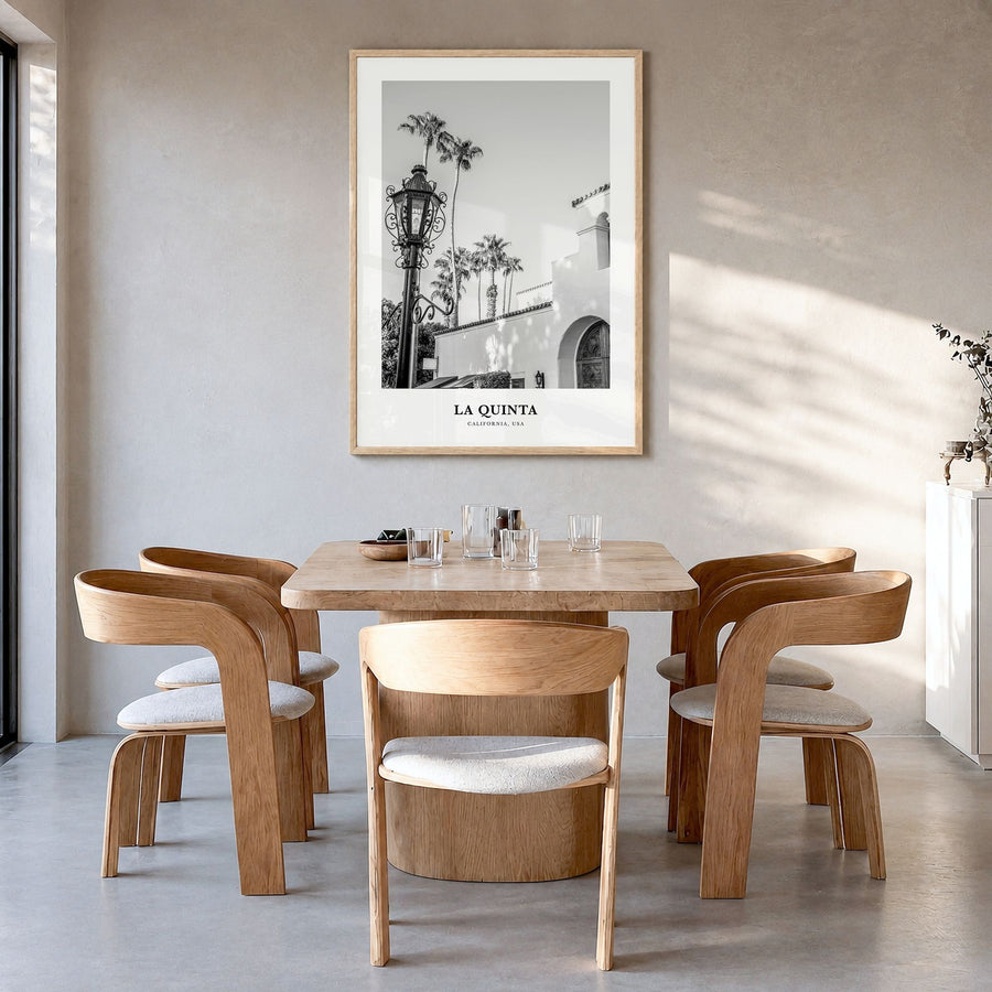 La Quinta Classic No 1 Poster in a natural wood frame, hanging in a dining room