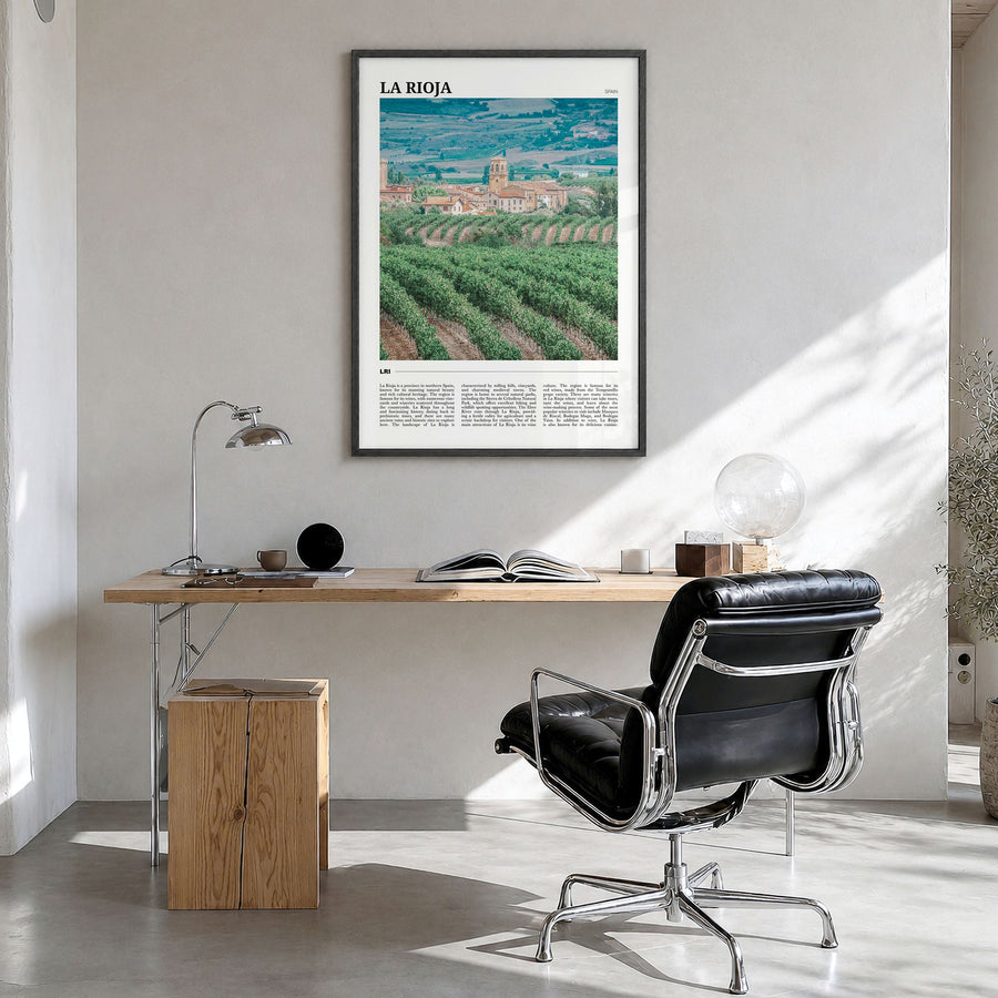 La Rioja Travel Poster in a black wood frame, hanging in a bright home office