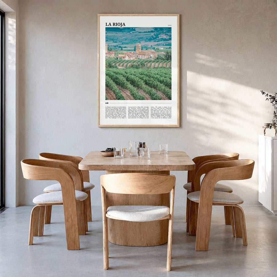 La Rioja Travel Poster in a natural wood frame, hanging in a dining room