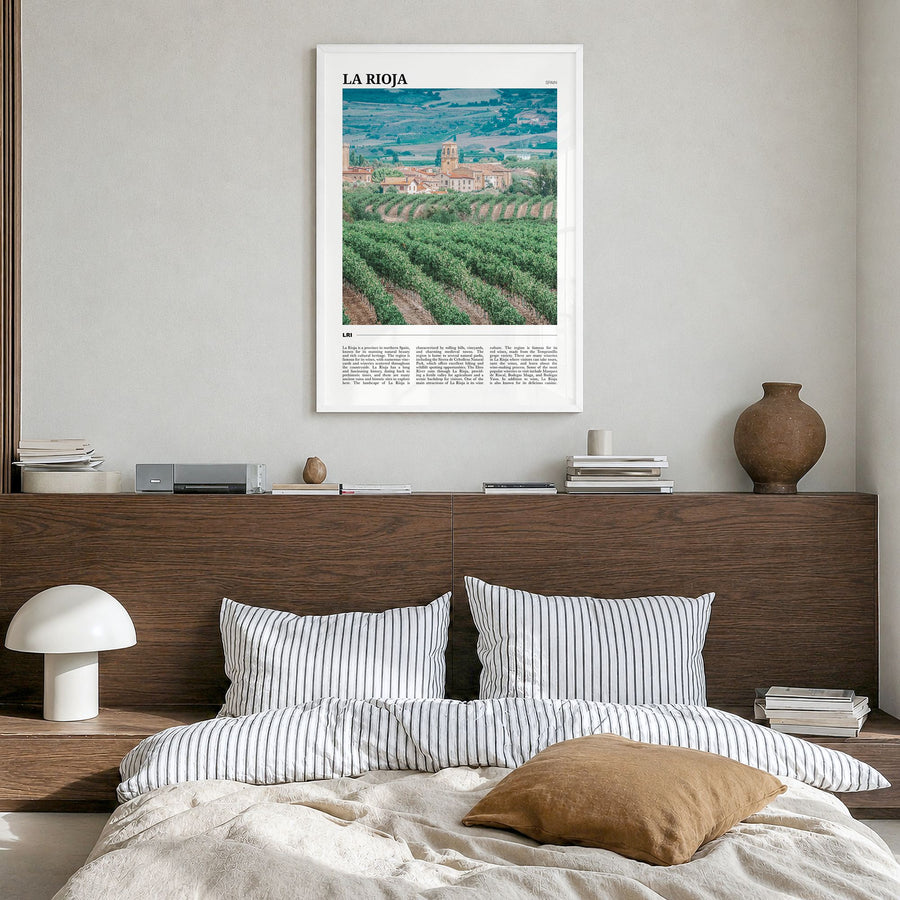 La Rioja Travel Poster in a white wood frame, hanging in a bedroom