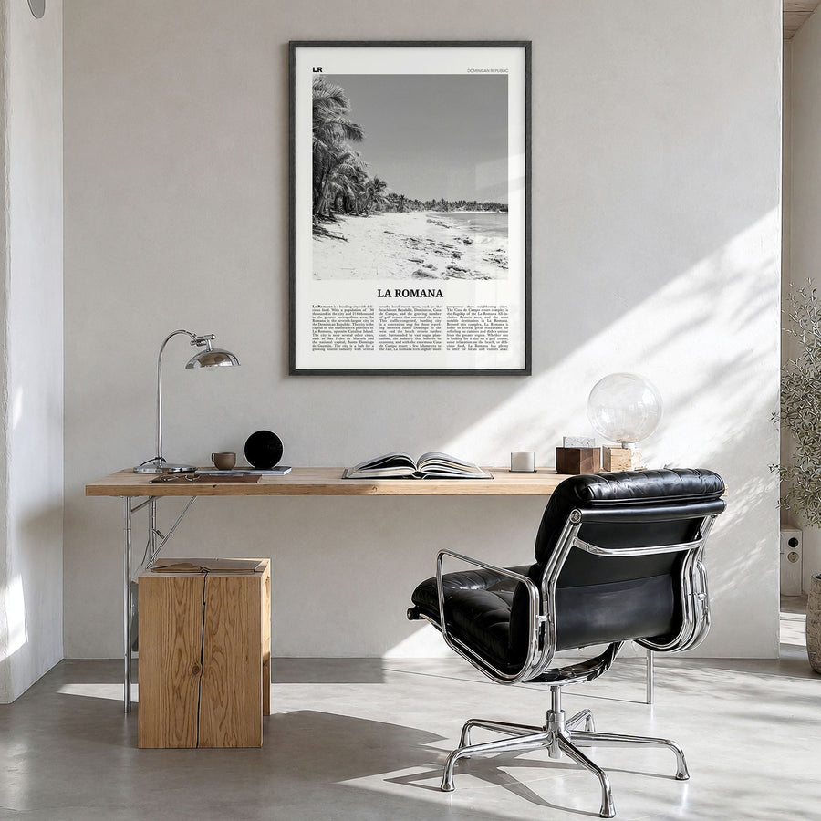 La Romana Newspaper Poster in a black wood frame, hanging in a bright home office