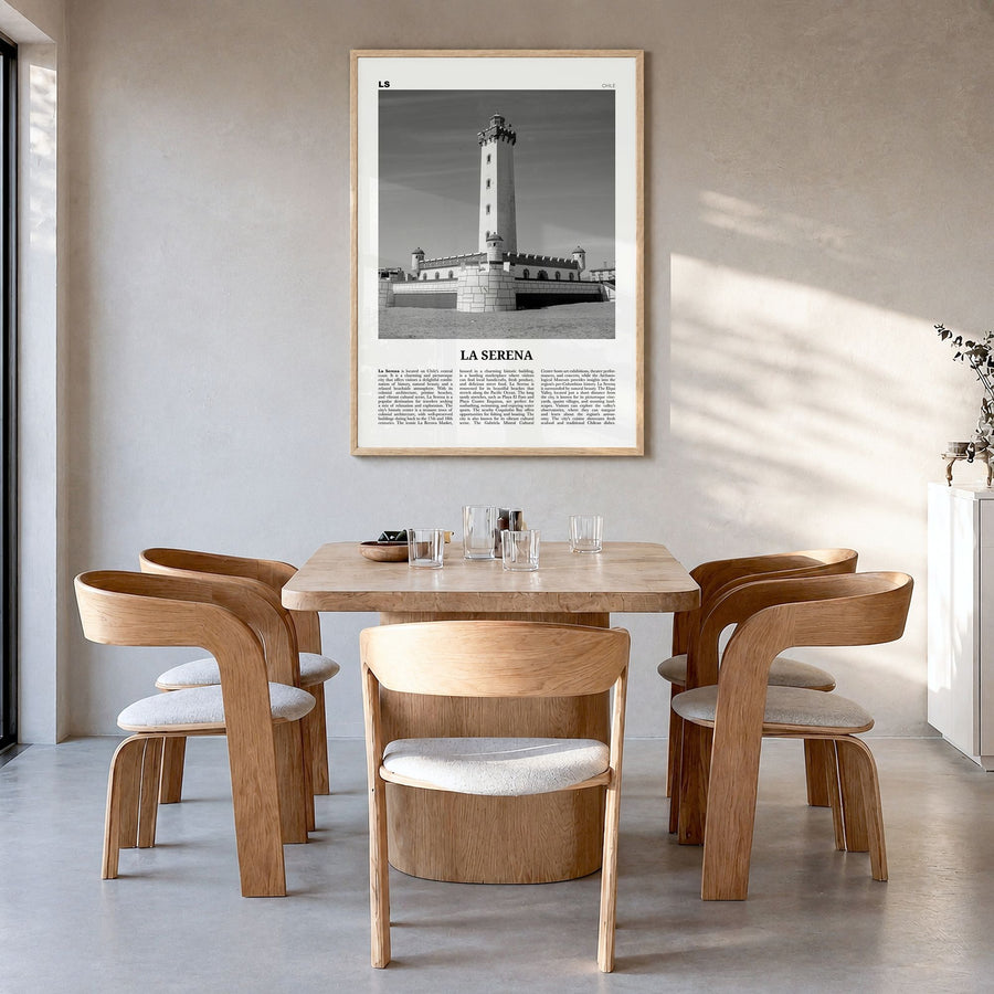La Serena Newspaper Poster in a natural wood frame, hanging in a dining room