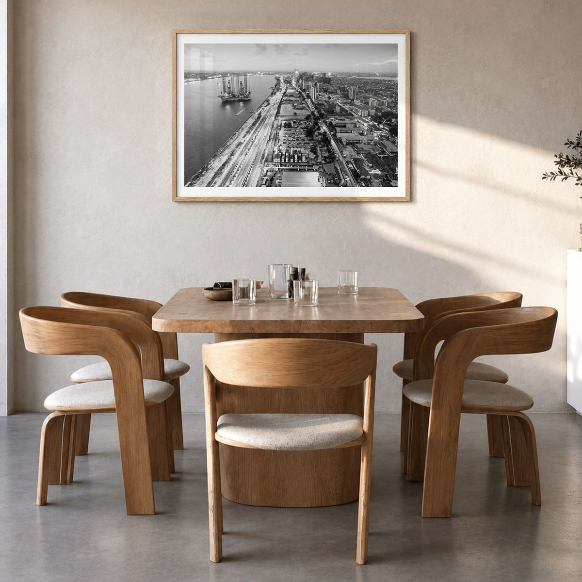 Lagos, Nigeria Photo Poster in a natural wood frame, hanging in a dining room, white border