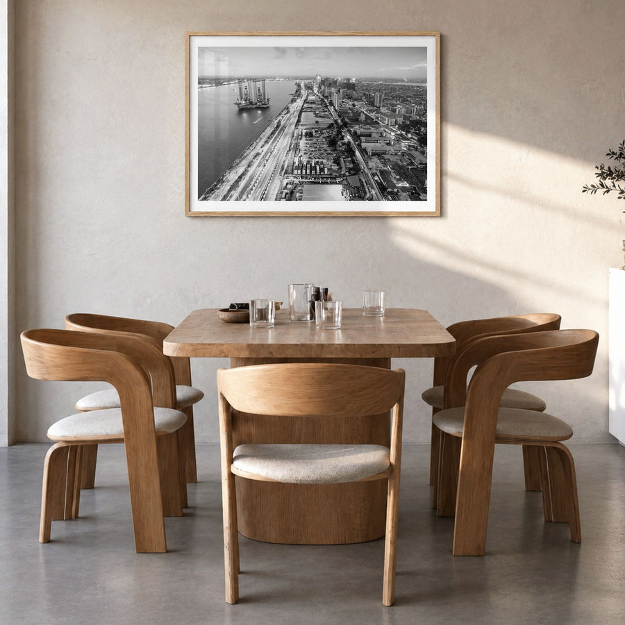 Lagos, Nigeria Photo Poster in a natural wood frame, hanging in a dining room, white border