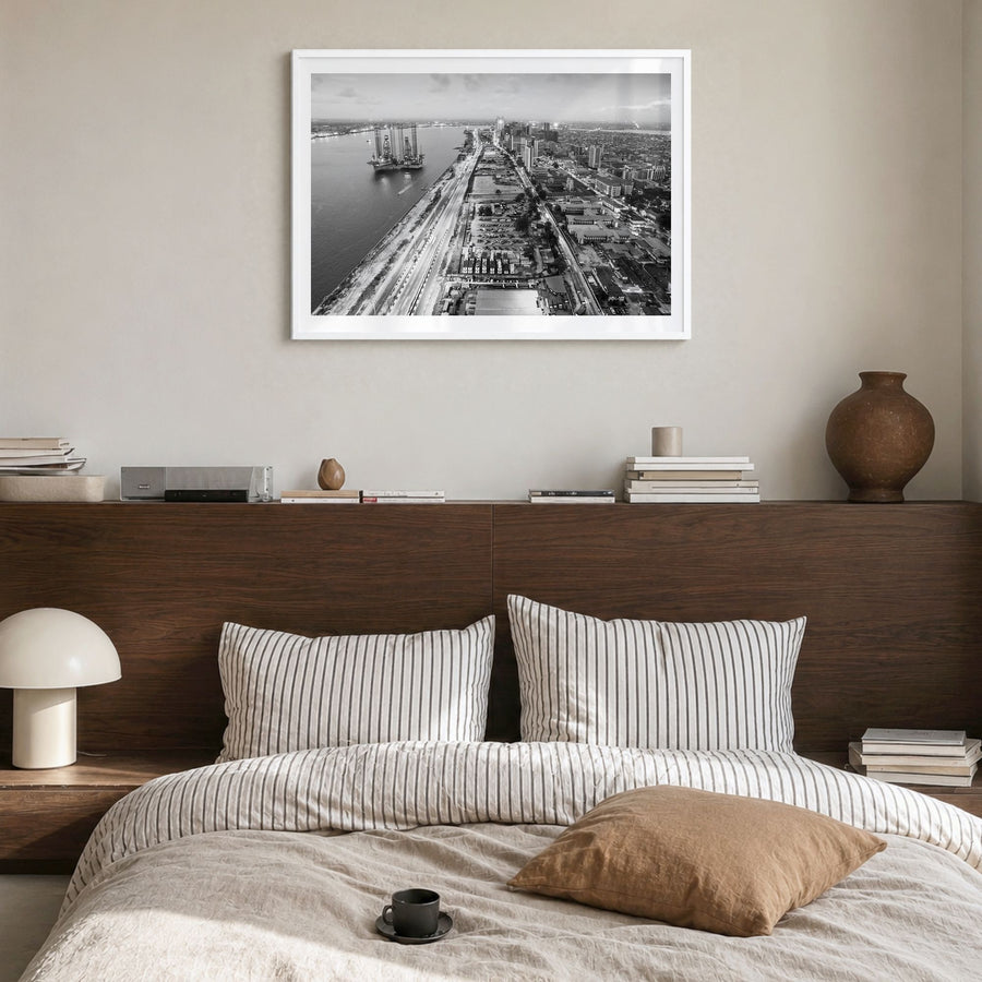 Lagos, Nigeria Photo Poster in a white wood frame, hanging in a bedroom, white border