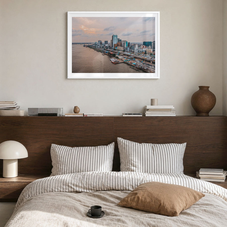 Lagos, Nigeria Photo Poster in a white wood frame, hanging in a bedroom, white border