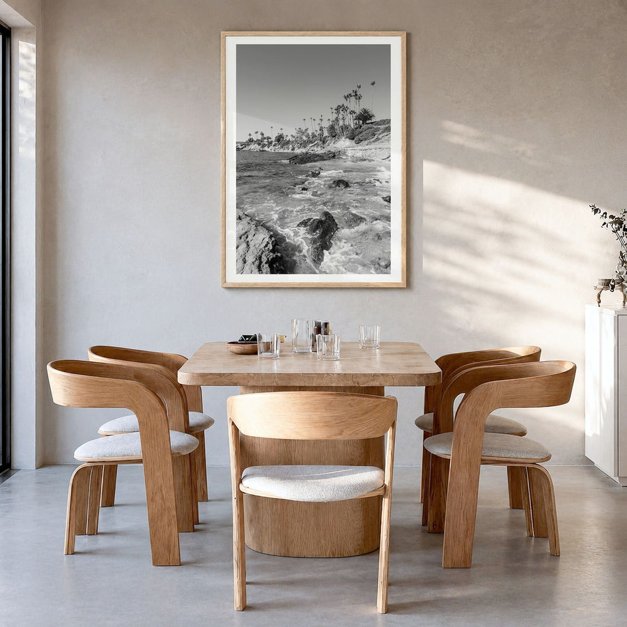 Laguna Beach Photo No 1 Poster in a natural wood frame, hanging in a dining room, white border