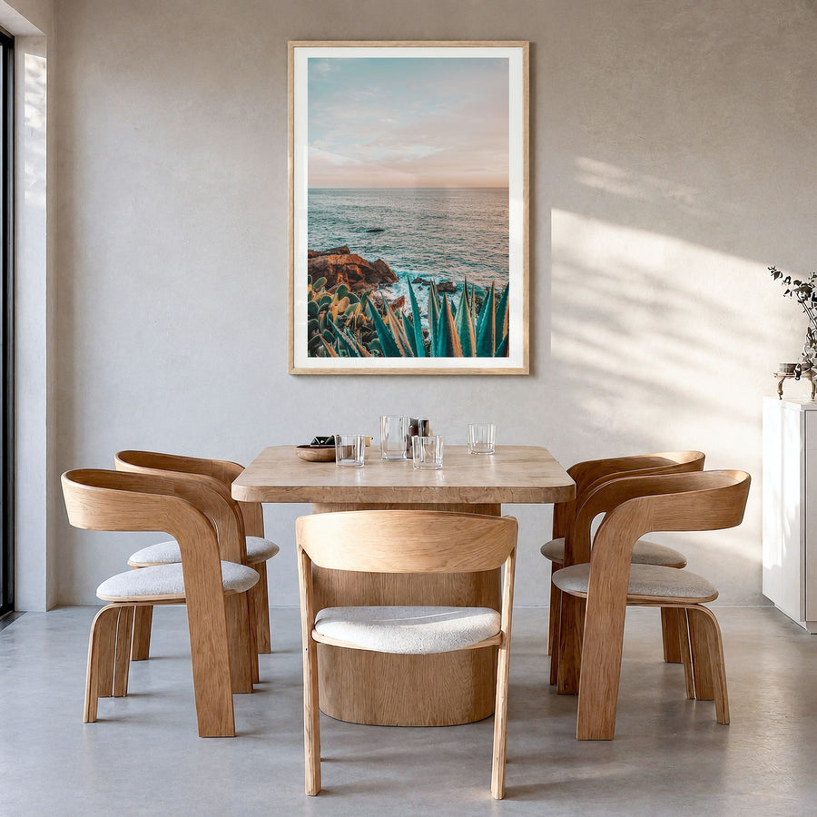 Laguna Beach Photo No 7 Poster in a natural wood frame, hanging in a dining room, white border