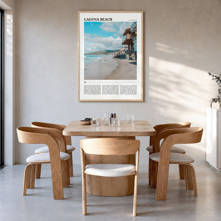 Laguna Beach Travel No 1 Poster in a natural wood frame, hanging in a dining room