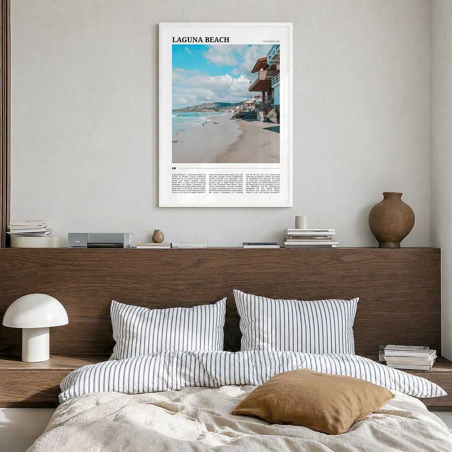Laguna Beach Travel No 1 Poster in a white wood frame, hanging in a bedroom