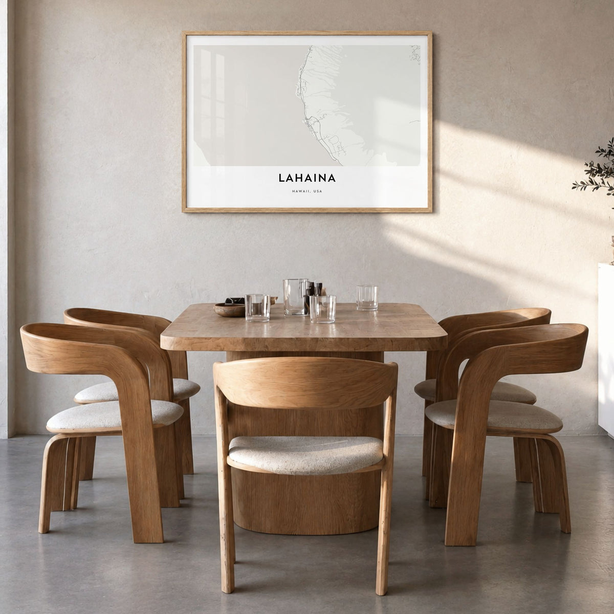 Lahaina Map Poster in a natural wood frame, hanging in a dining room