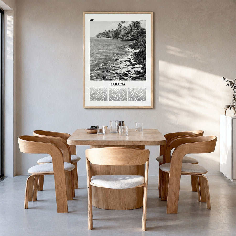 Lahaina Newspaper Poster in a natural wood frame, hanging in a dining room