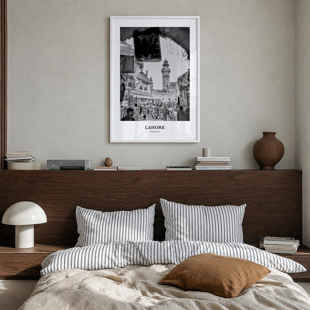 Lahore no. 1 black & white classic poster of Pakistan – vertical wall art in white wood frame, hanging on wall