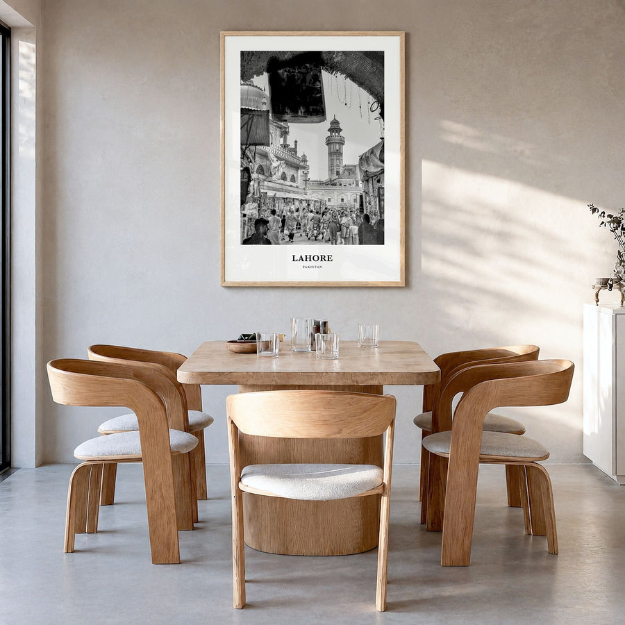 Lahore Classic No 1 Poster in a natural wood frame, hanging in a dining room