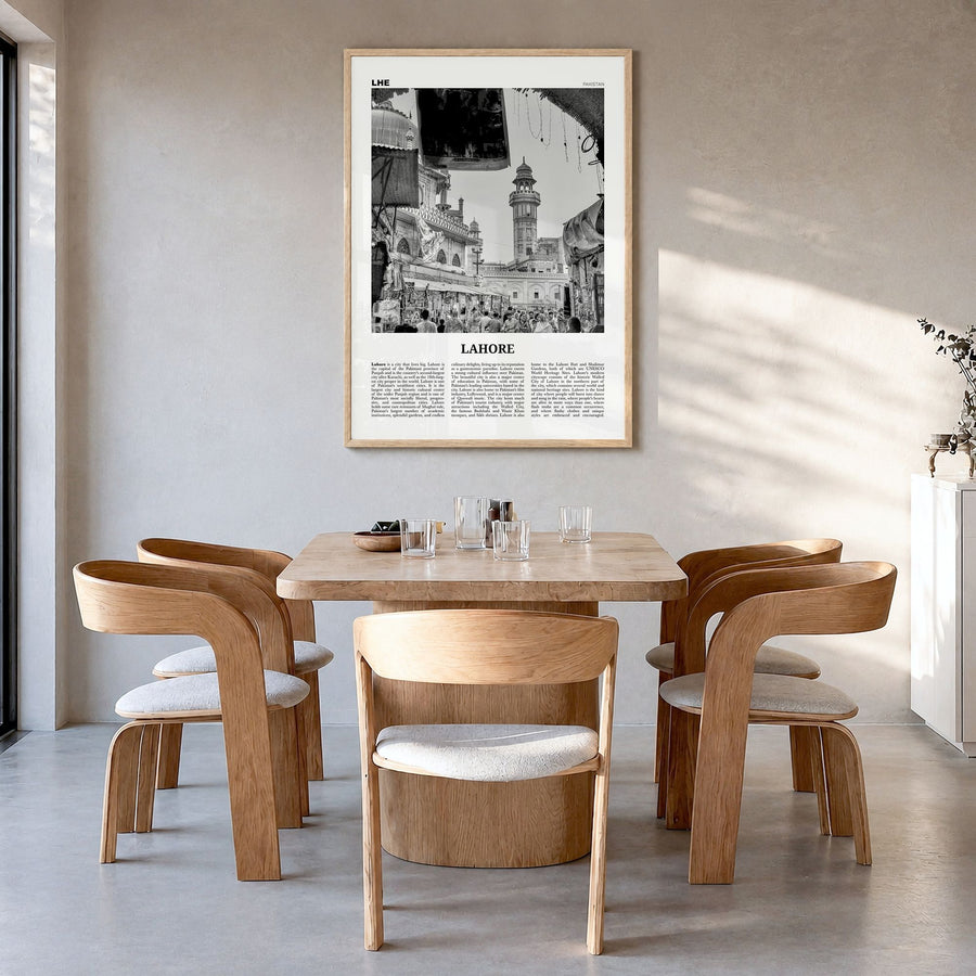 Lahore Newspaper No 1 Poster in a natural wood frame, hanging in a dining room