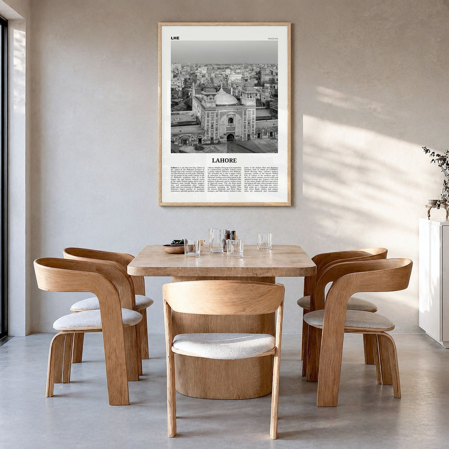 Lahore Newspaper No 2 Poster in a natural wood frame, hanging in a dining room