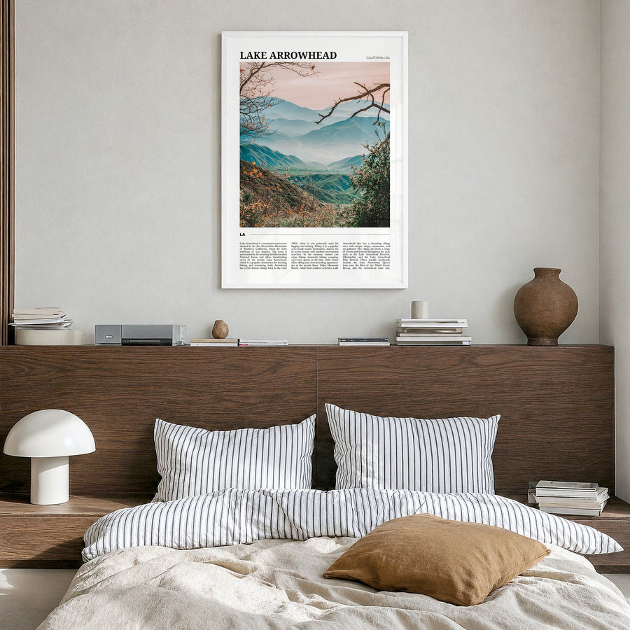 Lake Arrowhead Travel Poster in a white wood frame, hanging in a bedroom