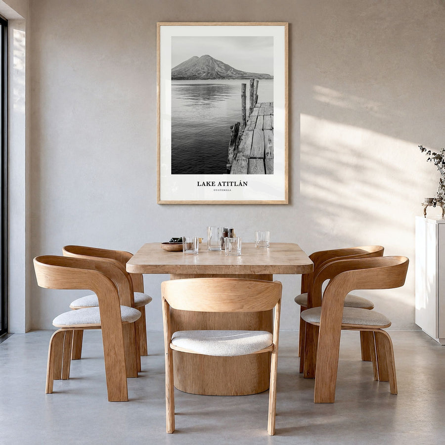 Lake Atitlán Classic Poster in a natural wood frame, hanging in a dining room