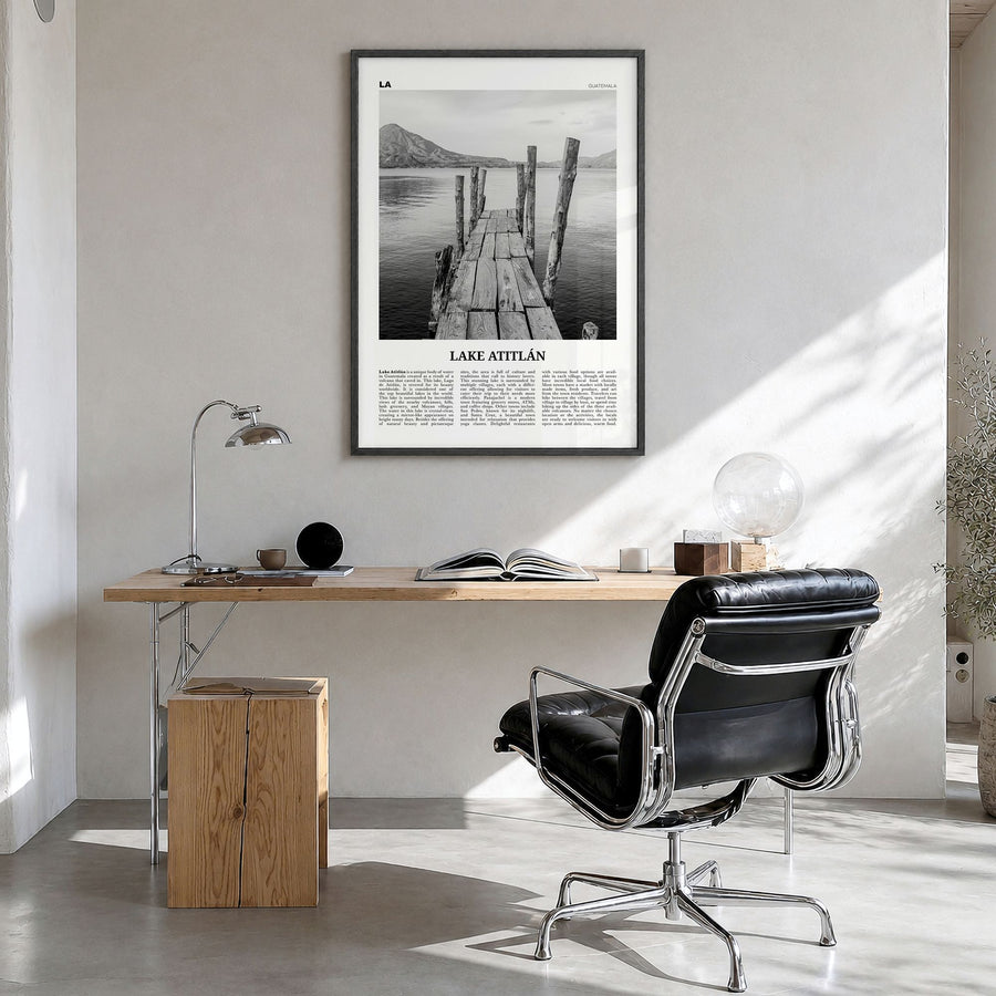 Lake Atitlán Newspaper Poster in a black wood frame, hanging in a bright home office