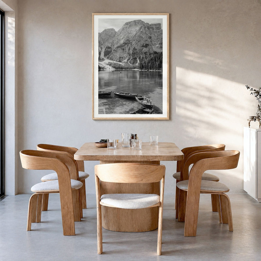 Lake Braies Photo Poster in a natural wood frame, hanging in a dining room, white border