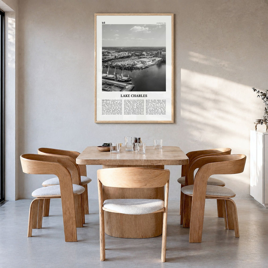 Lake Charles Newspaper Poster in a natural wood frame, hanging in a dining room