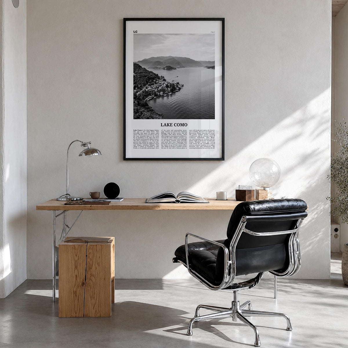 Lake Como black & white newspaper poster of Italy – vertical wall art in black wood frame, hanging on wall