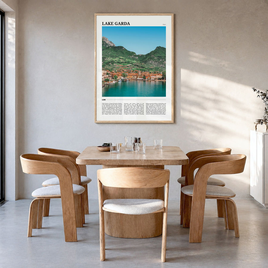 Lake Garda Travel Poster in a natural wood frame, hanging in a dining room